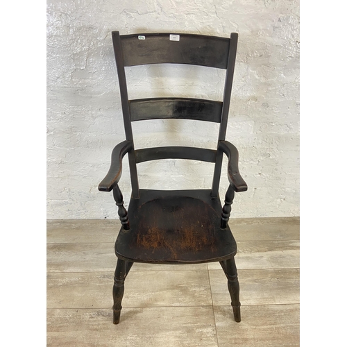 113 - A Victorian stained beech farmhouse armchair