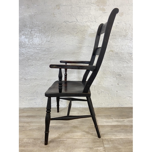 113 - A Victorian stained beech farmhouse armchair