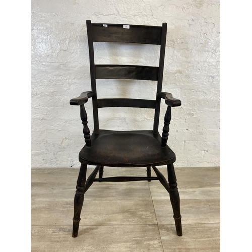 113 - A Victorian stained beech farmhouse armchair