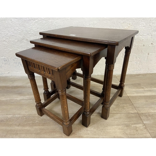 117 - Two nests of tables, one carved oak and one mahogany