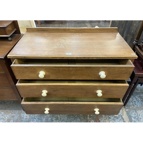 119 - An early 20th century oak chest of drawers - approx. 85cm high x 92cm wide x 44cm deep