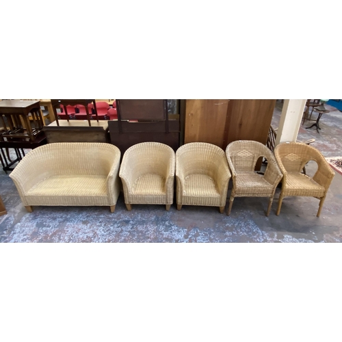 121 - Five pieces of wicker furniture, four armchairs and one sofa