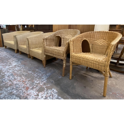 121 - Five pieces of wicker furniture, four armchairs and one sofa