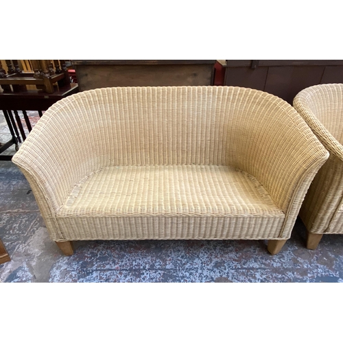 121 - Five pieces of wicker furniture, four armchairs and one sofa