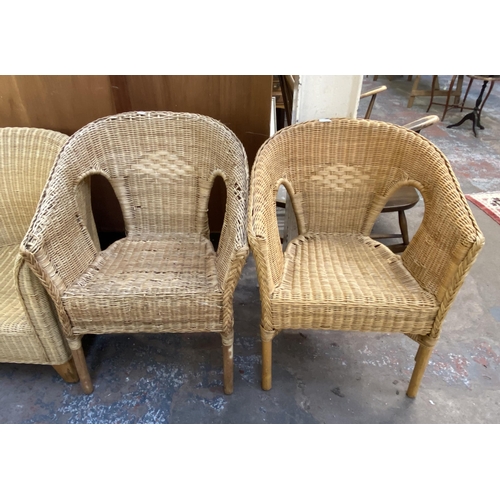 121 - Five pieces of wicker furniture, four armchairs and one sofa