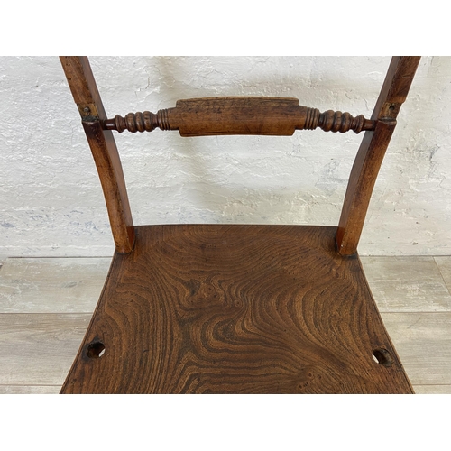 125 - A pair of Victorian elm and beech farmhouse dining chairs