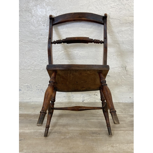 125 - A pair of Victorian elm and beech farmhouse dining chairs