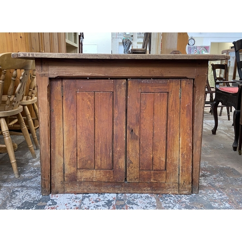 126 - A Victorian pitch pine two door cabinet - approx. 82cm high x 116cm wide x 53cm deep