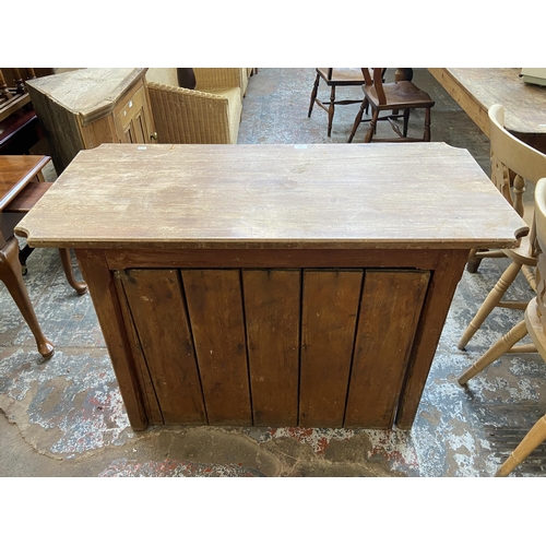 126 - A Victorian pitch pine two door cabinet - approx. 82cm high x 116cm wide x 53cm deep