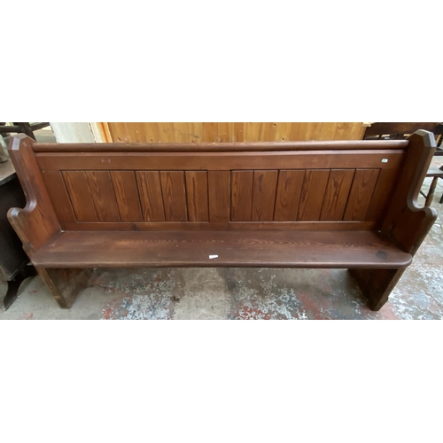 128 - A Victorian pitch pine church pew - approx. 92cm high x 185cm wide x 38cm deep