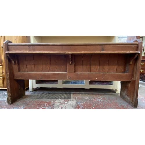 128 - A Victorian pitch pine church pew - approx. 92cm high x 185cm wide x 38cm deep