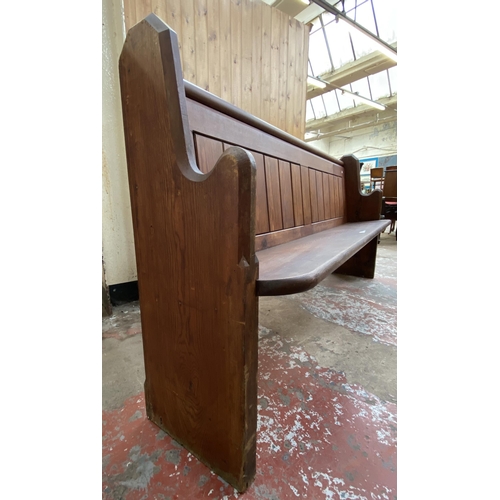 128 - A Victorian pitch pine church pew - approx. 92cm high x 185cm wide x 38cm deep