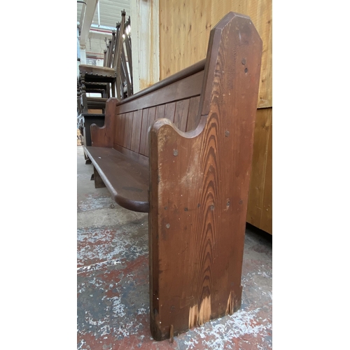 128 - A Victorian pitch pine church pew - approx. 92cm high x 185cm wide x 38cm deep