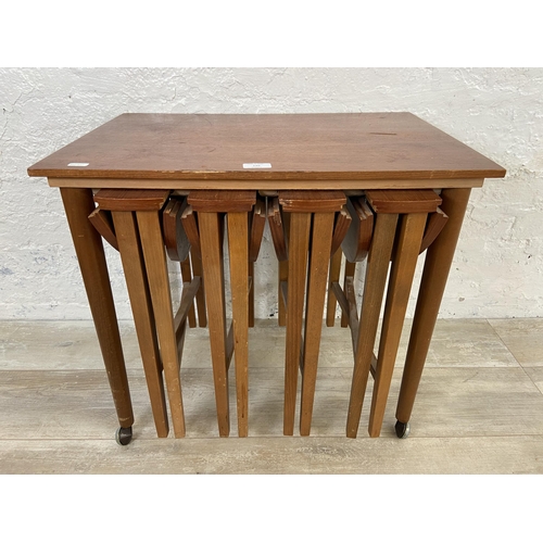 130 - A mid 20th century Poul Hundevad teak nest of tables - approx. 56cm high x 62cm wide x 42cm deep