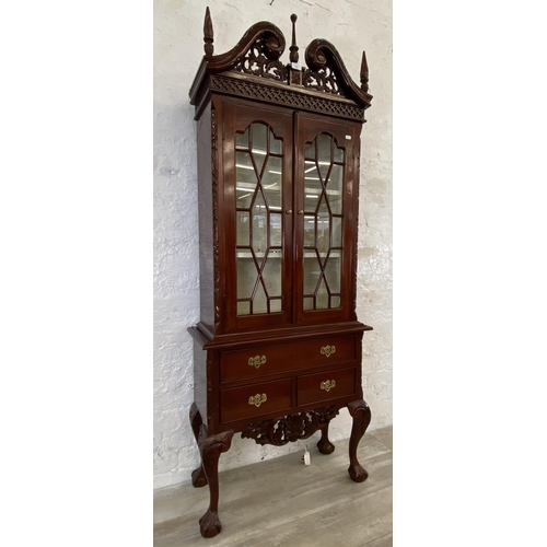 132 - A Georgian style carved mahogany display cabinet on ball and claw supports - approx. 180cm high x 70... 