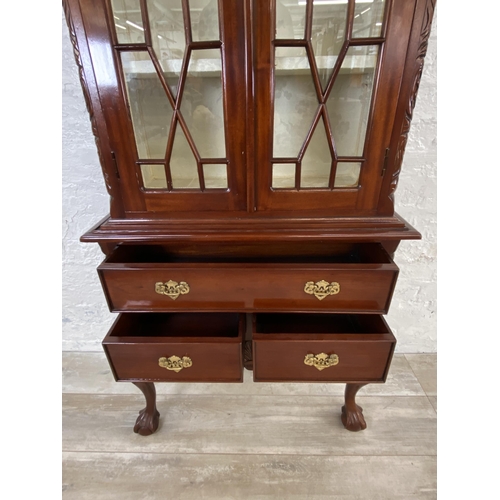 132 - A Georgian style carved mahogany display cabinet on ball and claw supports - approx. 180cm high x 70... 