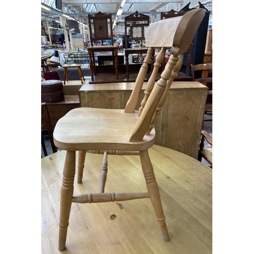 136 - A Victorian style pine circular tripod pedestal dining table and five Victorian style beech farmhous... 