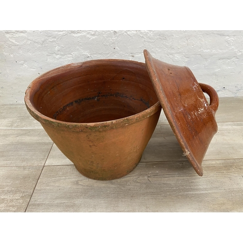 138 - A terracotta pot with Victorian glazed terracotta lid - approx. 40cm high