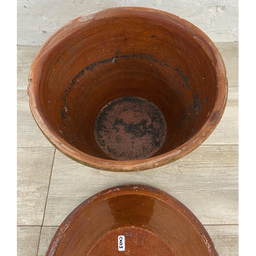 138 - A terracotta pot with Victorian glazed terracotta lid - approx. 40cm high