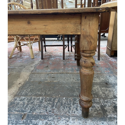 141 - A Victorian pine farmhouse kitchen table with single drawer - approx. 74cm high x 105cm wide x 228cm... 