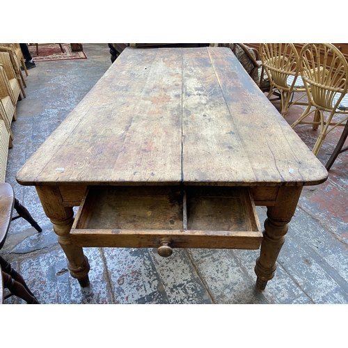 141 - A Victorian pine farmhouse kitchen table with single drawer - approx. 74cm high x 105cm wide x 228cm... 