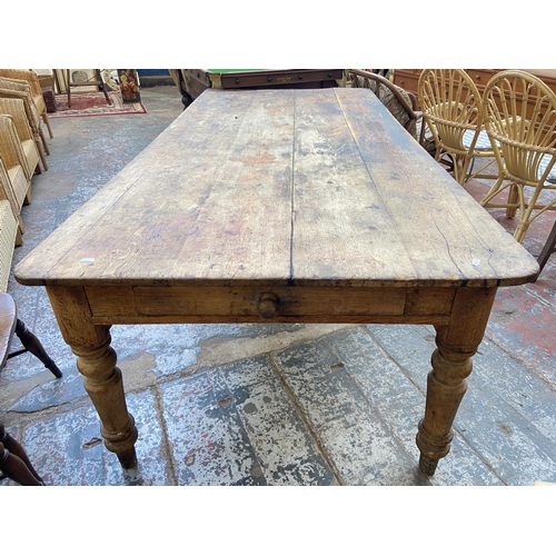 141 - A Victorian pine farmhouse kitchen table with single drawer - approx. 74cm high x 105cm wide x 228cm... 