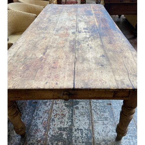 141 - A Victorian pine farmhouse kitchen table with single drawer - approx. 74cm high x 105cm wide x 228cm... 