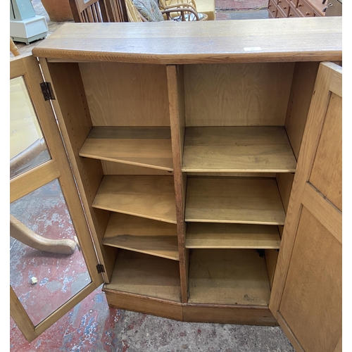 147 - A mid 20th century Bowman Bros Ltd of Camden Town London carved oak linenfold bookcase - approx. 117... 