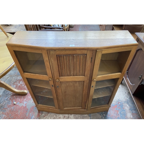 147 - A mid 20th century Bowman Bros Ltd of Camden Town London carved oak linenfold bookcase - approx. 117... 