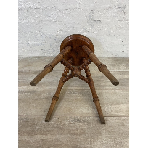 159 - A Victorian elm circular top bobbin turned stool - approx. 50cm high x 28cm diameter