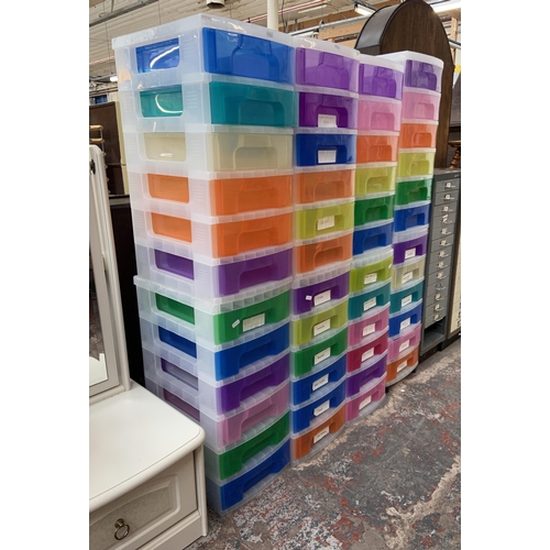 160 - Eight multicoloured plastic six drawer filing cabinets - approx. 67cm high x 31cm wide x 42cm deep