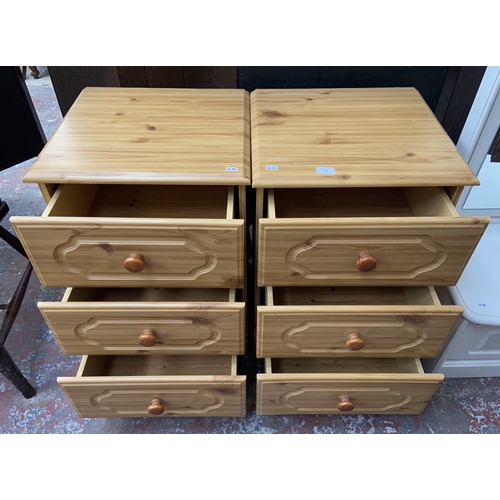 163 - A pair of pine effect bedside chests of drawers - approx. 70cm high x 47cm wide x 44cm deep