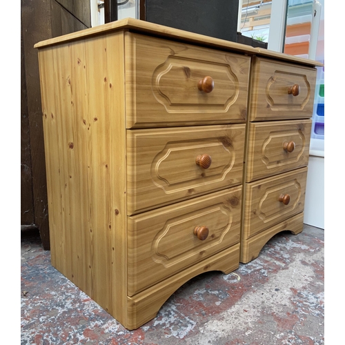 163 - A pair of pine effect bedside chests of drawers - approx. 70cm high x 47cm wide x 44cm deep