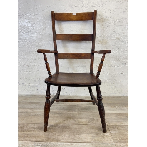 164 - A Victorian elm and beech ladder back farmhouse armchair - approx. 108cm high x 58cm wide x 47cm dee... 