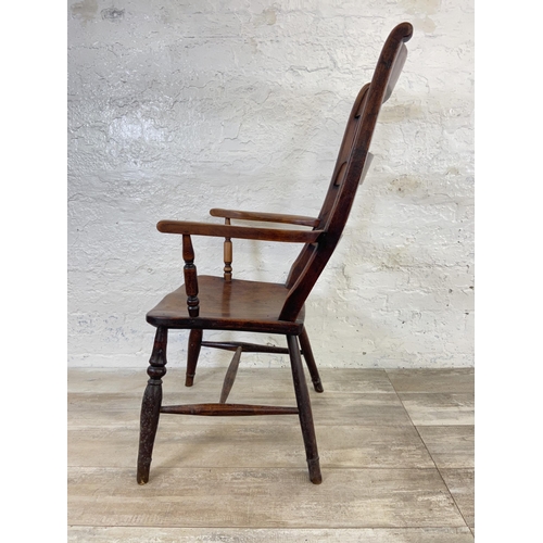 164 - A Victorian elm and beech ladder back farmhouse armchair - approx. 108cm high x 58cm wide x 47cm dee... 