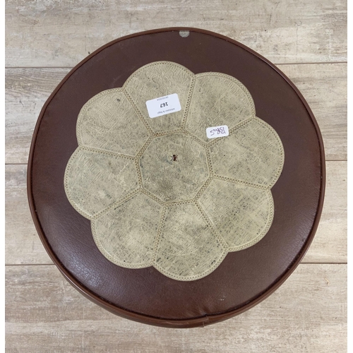 167 - A mid 20th century brown and cream vinyl circular footstool - approx. 29cm high x 36cm diameter