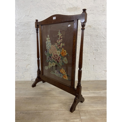 171 - Two early 20th century fire screens, one mahogany and fabric shield shaped and one oak and tapestry ... 