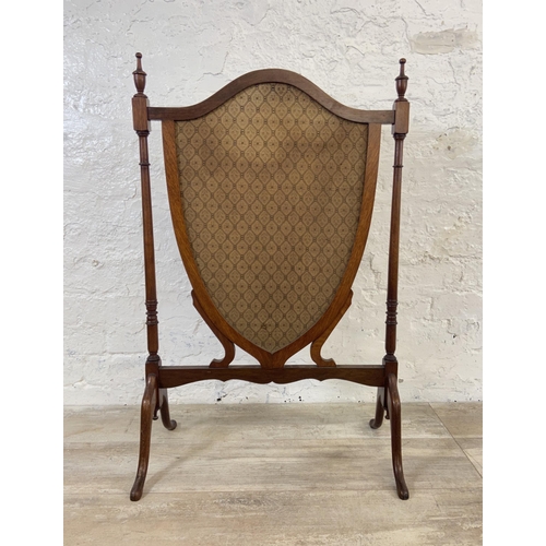 171 - Two early 20th century fire screens, one mahogany and fabric shield shaped and one oak and tapestry ... 