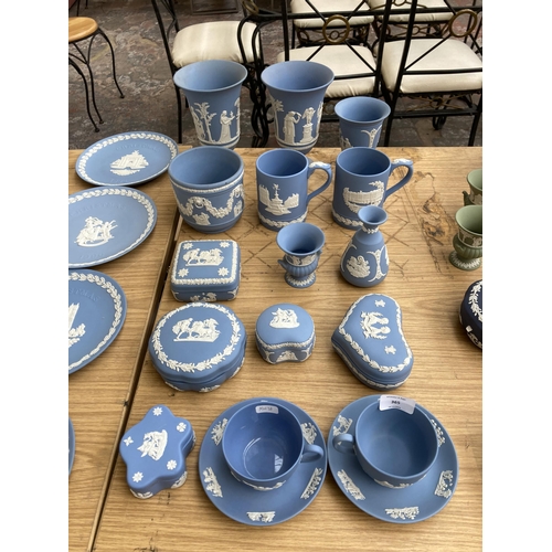 365 - Seventeen pieces of Wedgwood pale blue Jasperware to include two cups and saucers, five trinket boxe... 