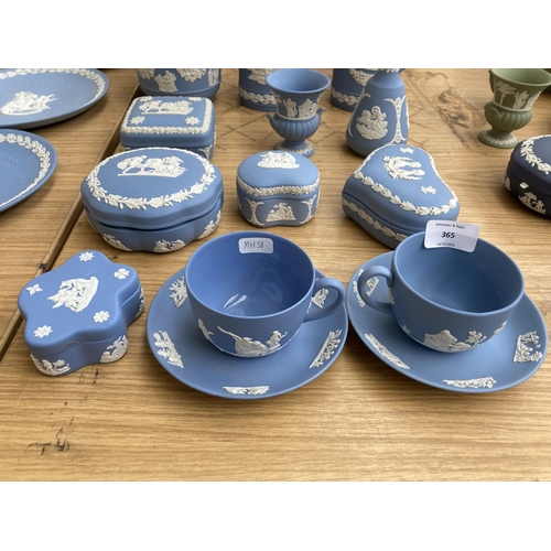 365 - Seventeen pieces of Wedgwood pale blue Jasperware to include two cups and saucers, five trinket boxe... 