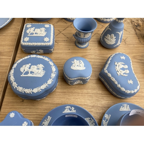 365 - Seventeen pieces of Wedgwood pale blue Jasperware to include two cups and saucers, five trinket boxe... 