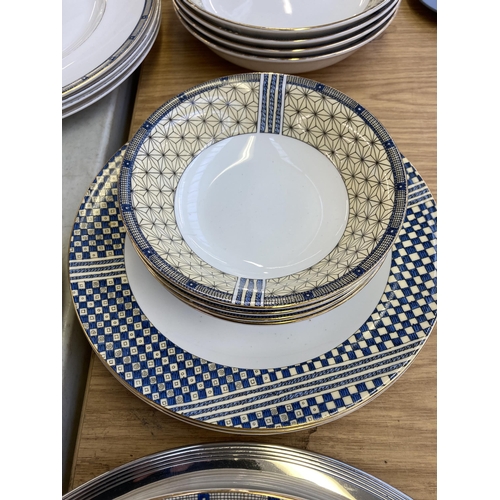 367 - Twenty six pieces of Wedgwood Samurai bone china together with a silver plated circular tray