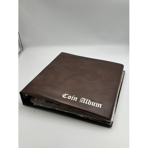 2402 - A coin album containing a collection of world coins