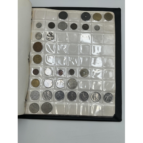 2402 - A coin album containing a collection of world coins