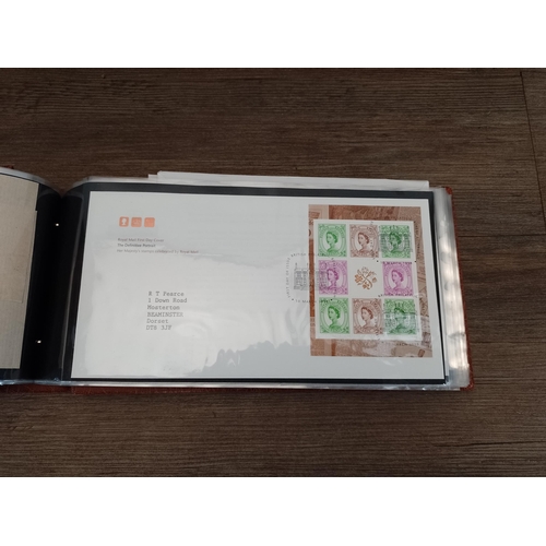 Eight albums containing a large collection of first day covers