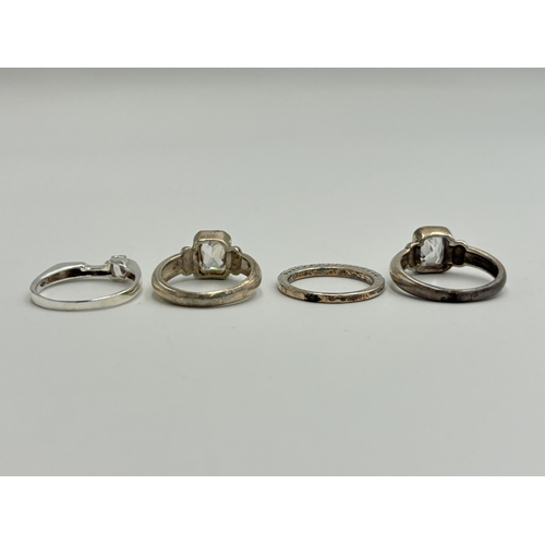 2222 - Four .925 silver CZ set dress rings - approx. gross weight 13g