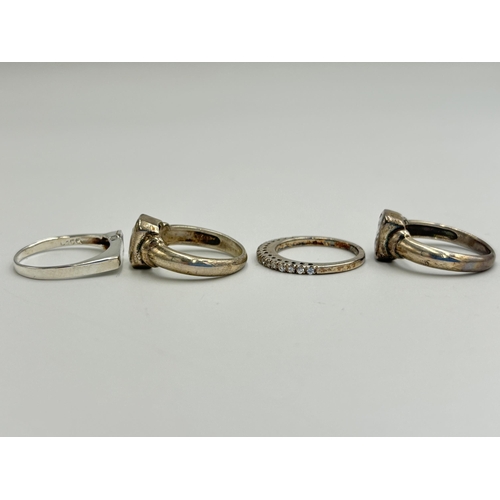 2222 - Four .925 silver CZ set dress rings - approx. gross weight 13g