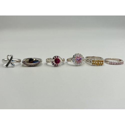 2232 - Six .925 silver gemstone set rings to include citrine and garnet spinner, amethyst, marcasite etc. -... 