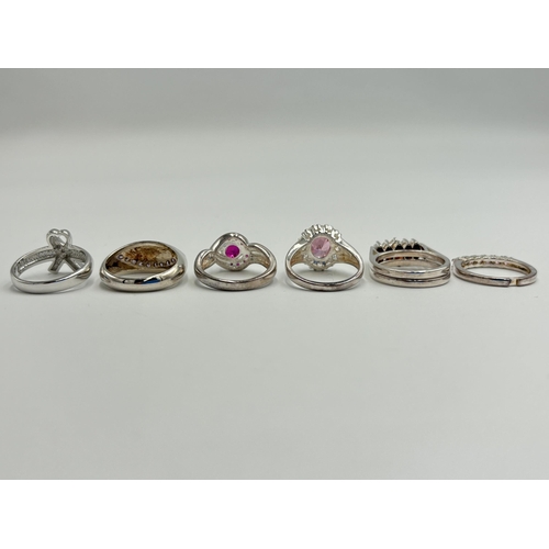 2232 - Six .925 silver gemstone set rings to include citrine and garnet spinner, amethyst, marcasite etc. -... 