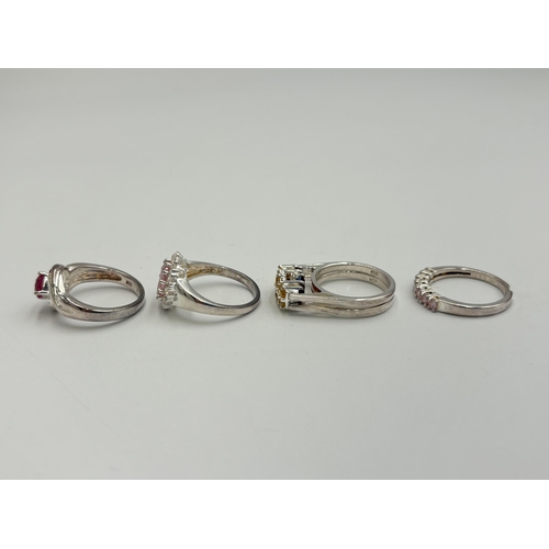 2232 - Six .925 silver gemstone set rings to include citrine and garnet spinner, amethyst, marcasite etc. -... 